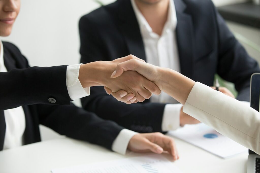 Business handshake (M&A)